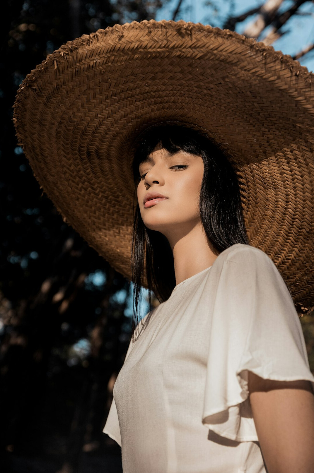 Professional headshot of an Asian-Brazilian woman