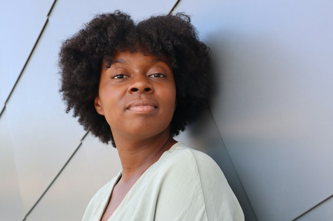 Professional headshot of an Afro-Brazilian woman