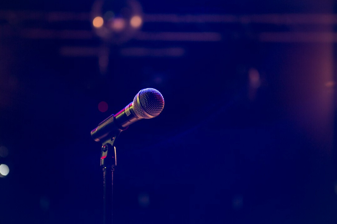speaker on stage with microphone