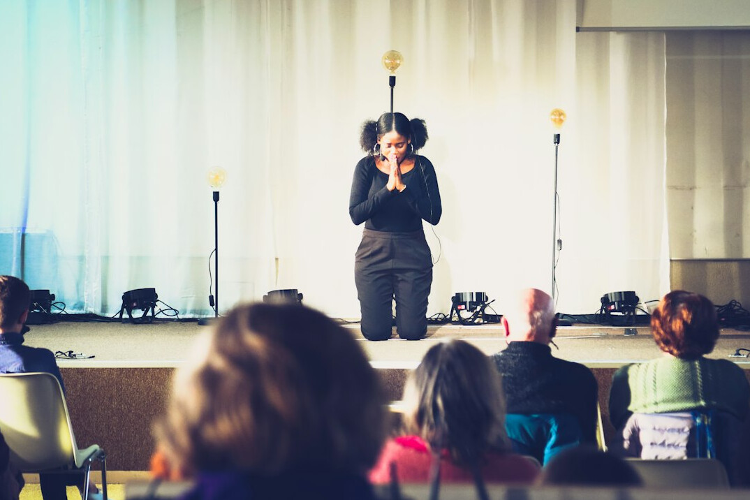 person speaking confidently on stage